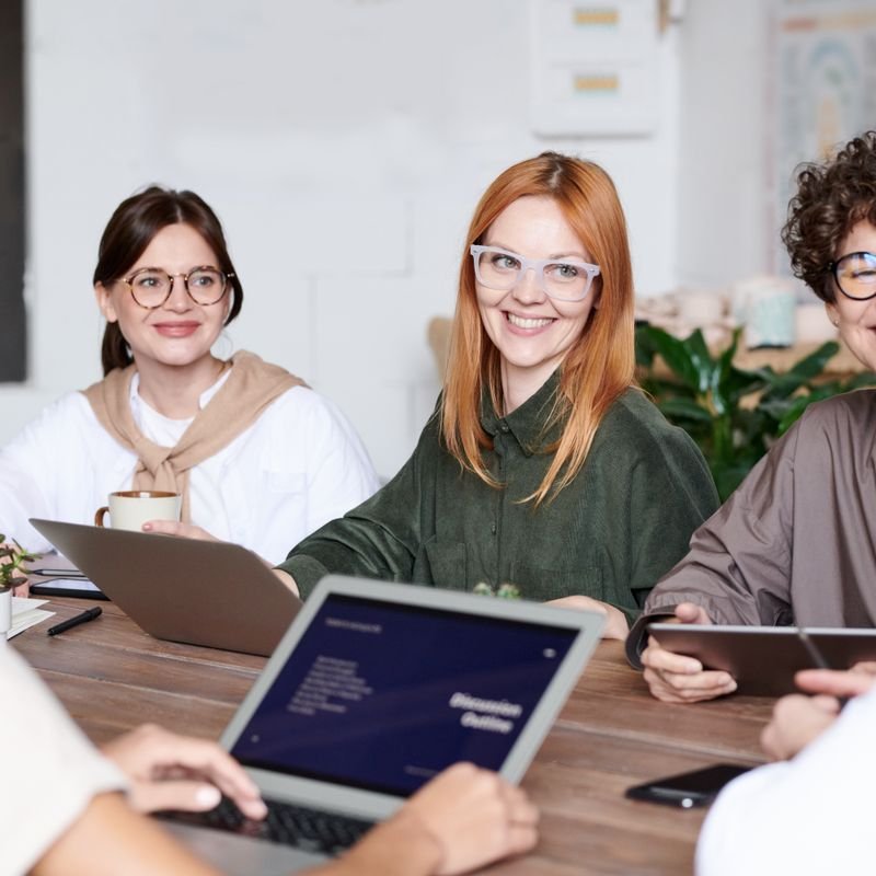A large group gathered in a workspace