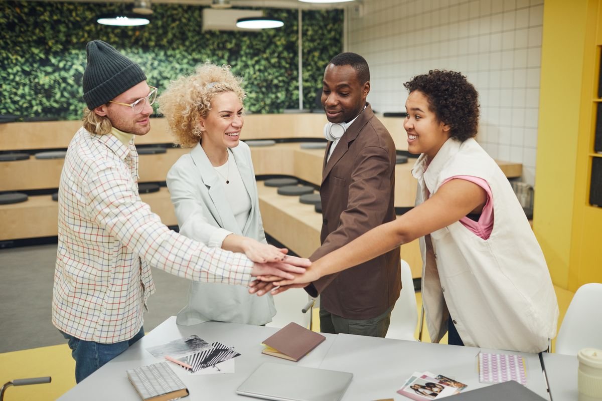 Colleagues gathered in conversation in a workspace