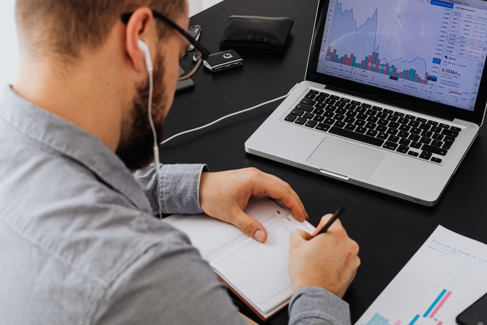 A professional reviewing work at a desk