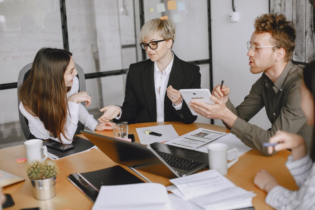 A team reviewing work together in a meeting room
