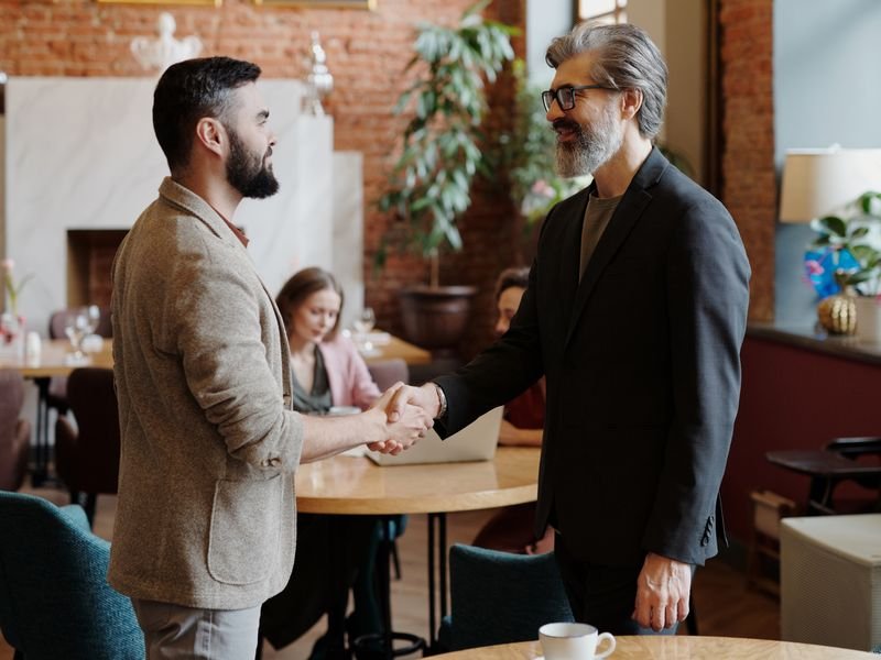 Two professionals shaking hands